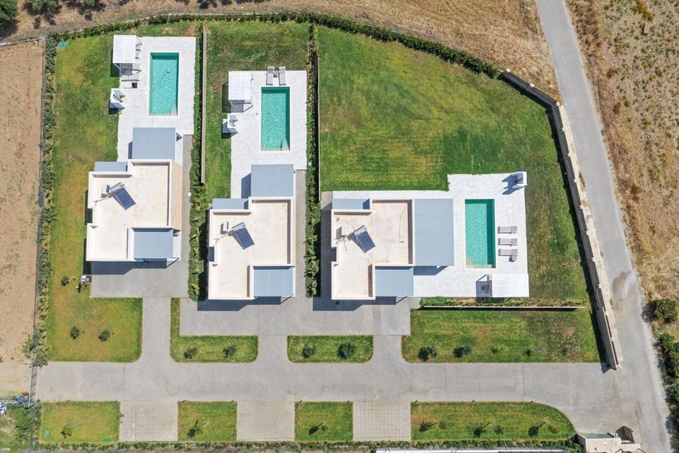 Aerial view of the three ŌNAR villas, each with its own pool and garden