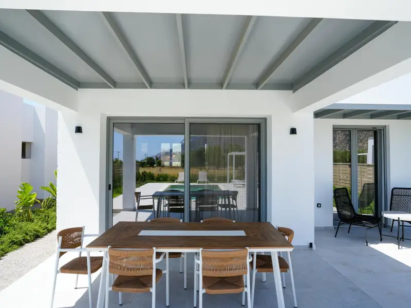 Outdoor dining area beside the living room doors