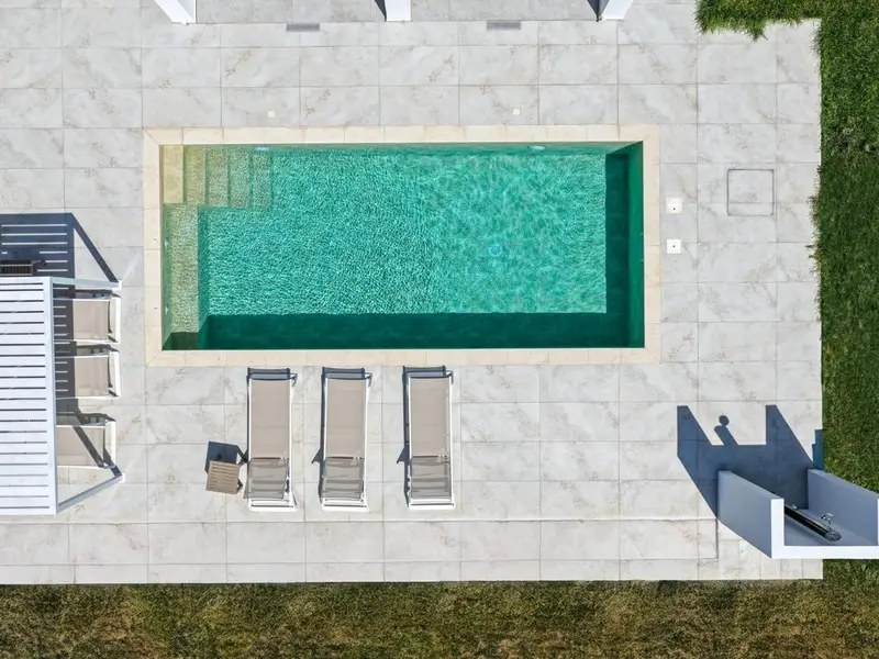 Overhead view of a private pool and sun terrace