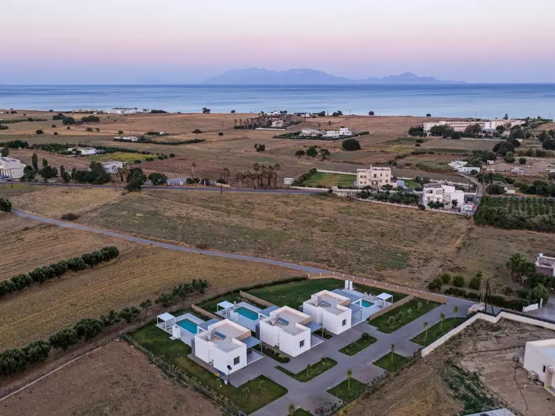 Sunrise over the sea seen from above the villas