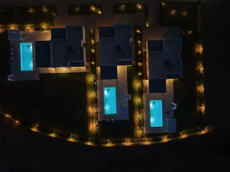 Garden lighting around the pools after dark