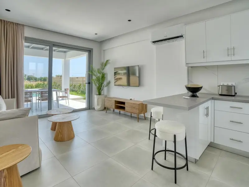 Open-plan living room, dining table and kitchen
