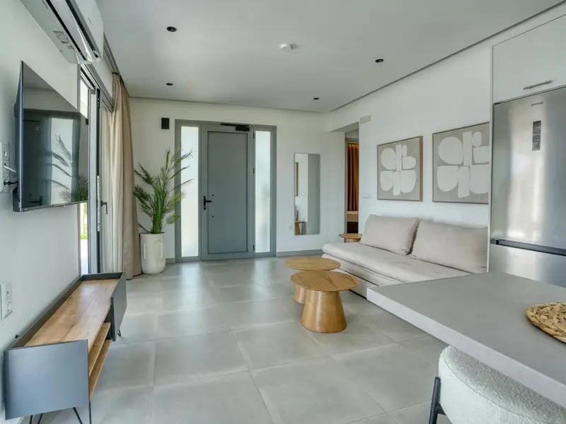 Living space with kitchen island and smart TV