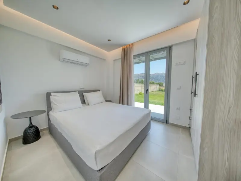 Double bedroom with garden and mountain views
