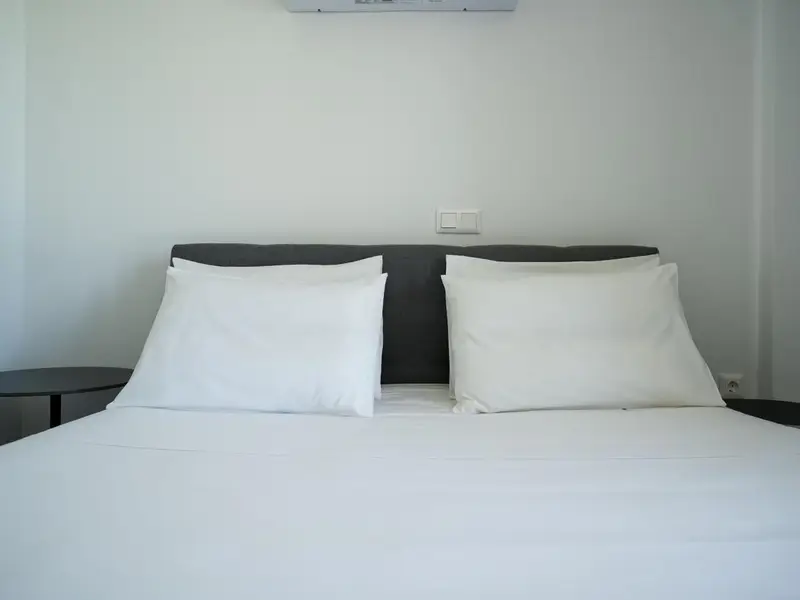 Crisp linen on the double bed