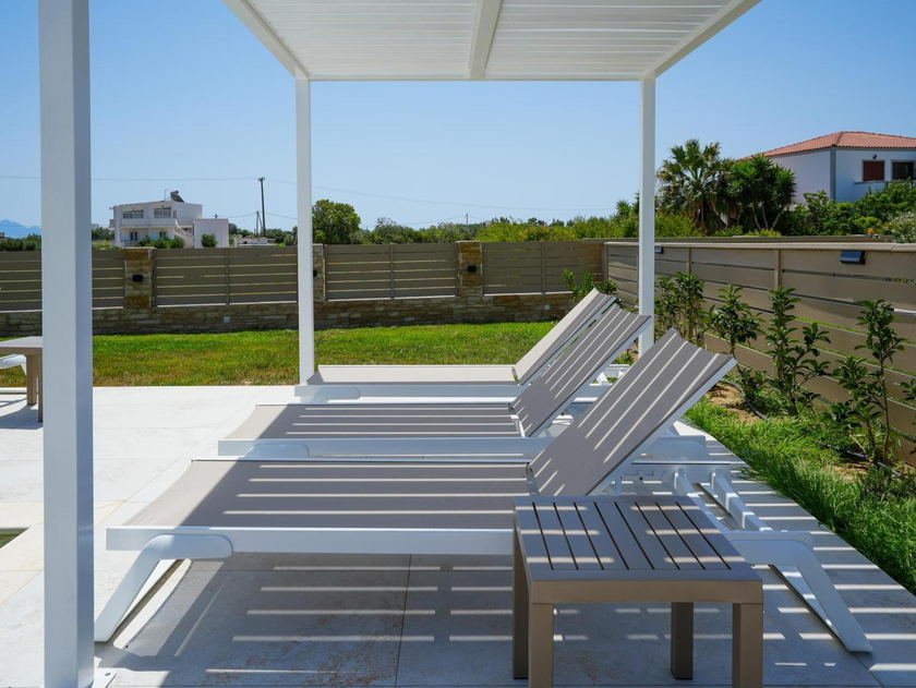 Sun loungers beside the pool