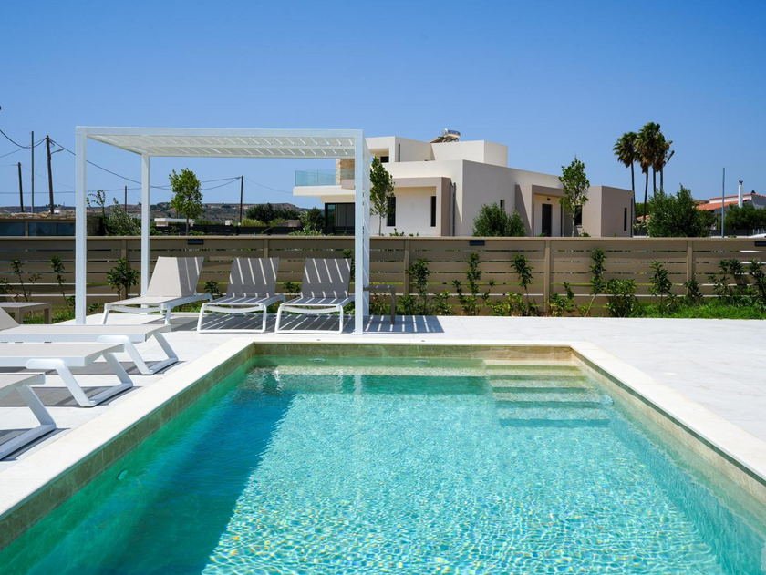 Turquoise private pool beside the sun terrace