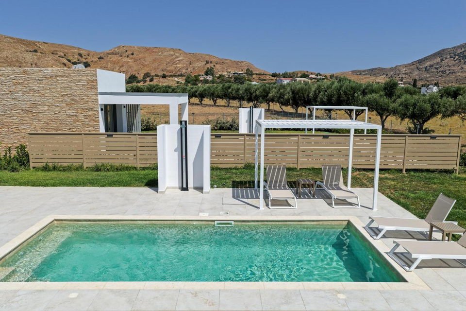 Private pool and sun loungers in the afternoon light