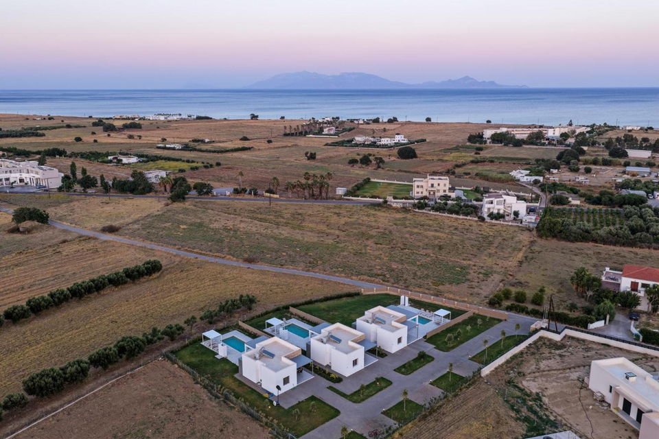 Sunrise over the sea seen from above the villas